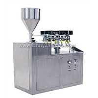 Metallic tube filling & sealing machine