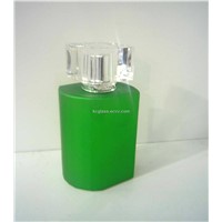glass perfume bottle with green cover