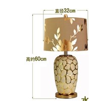 Ceramic lamp. The bed lamp is golden. Lamp can adjust light.