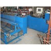Semi-automatic chain link weaving machine