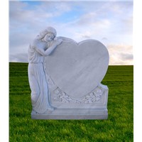 White headstone angel monument with heart carving