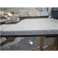 Natural stone laminated with granite and fiberglass