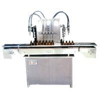 Automatic volumetric liquid bottle filling machine