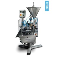 Tube filling and sealing machine for plastic and laminated tubes