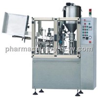 Soft tube filling and sealing machine