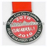 Metal sports medal with ribbon