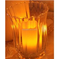 Clear glass flowered candle holder