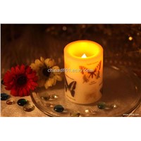LED candle with butterfly decoration