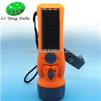 Multifuntional dynamo flashlight with radio and phone charging function