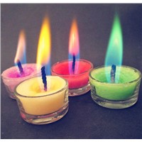 Colored flame tea light candle with glass holder
