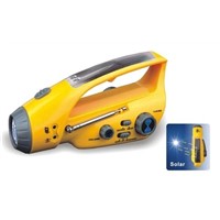 Solar dynamo torch with FM radio charger