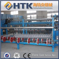 Automatic chain link fence weaving machine