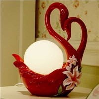 A1 Creative wedding red warm bedroom nightstand lamp utility Swan high-end European wedding room wedding gift