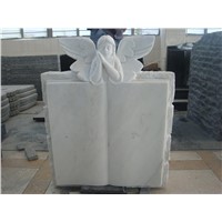 White marble angel with book headstone