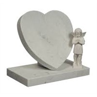 White marble headstone with heart shape children monument