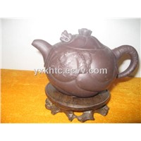 Dark-red enameled pottery teapot