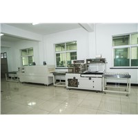 Automatic high speed side sealing shrink wrapping machine