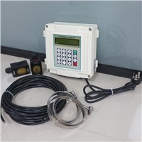 Low cost digital ultrasonic flow meter with clamp on sensors